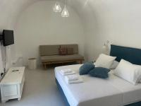 Posteľ alebo postele v izbe v ubytovaní Tholos Cottage