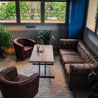 Χώρος καθιστικού στο Hotel de l'Abbaye à Cluny