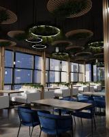 een restaurant met tafels, stoelen en ramen bij Friday Old City Hotel in Tasjkent