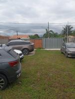 a group of parked cars parked in a yard at Pousada Portico de Buzios in Armacao dos Buzios