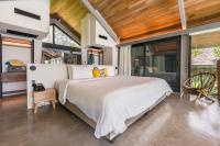 Ein Bett oder Betten in einem Zimmer der Unterkunft Island Escape Burasari