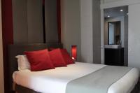 Postel nebo postele na pokoji v ubytov&aacute;n&iacute; Hotel du Fronton