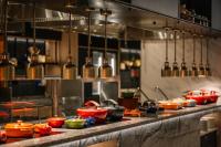 a kitchen with many pots and pans on a counter at Iconic Marjorie Hotel, Penang, a Tribute Portfolio Hotel in Bayan Lepas