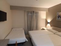 Postel nebo postele na pokoji v ubytování Hotel Villa De Pinto
