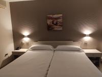 Postel nebo postele na pokoji v ubytování Hotel Villa De Pinto