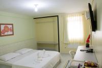 a hospital room with a bed and a window at JR Hotel in João Pessoa
