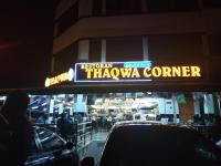 uma placa indicando um teatro em uma cidade à noite em FAZ Homestay Nilai em Nilai