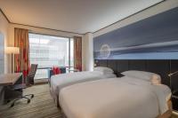 Hyatt Regency Taoyuan International Airportにあるベッド