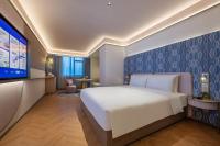 Manxin Hotel Wuhan Hankou Fanhai CBD Xinhua Roadにあるベッド