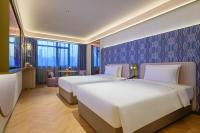 Manxin Hotel Wuhan Hankou Fanhai CBD Xinhua Roadにあるベッド
