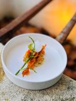 a white plate with food on top of a table at Le Clos d'Amboise in Amboise