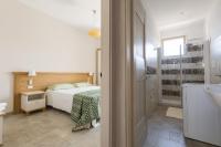 Posteľ alebo postele v izbe v ubytovaní Residence Il Colle