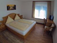 Postel nebo postele na pokoji v ubytování Hotel Haus Rameil
