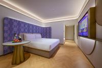 Manxin Hotel Wuhan Hankou Fanhai CBD Xinhua Roadにあるベッド