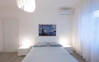 Novegro Apartment Milano Linateにあるベッド