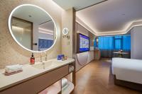 Manxin Hotel Wuhan Hankou Fanhai CBD Xinhua Roadにあるベッド