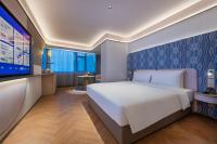 Manxin Hotel Wuhan Hankou Fanhai CBD Xinhua Roadにあるベッド