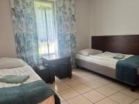 Posteľ alebo postele v izbe v ubytovaní Motel w Łące