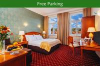 a hotel room with a bed and a desk at Hotel St George - Czech Leading Hotels in Prague