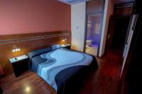 A bed or beds in a room at Motel Los Abedules