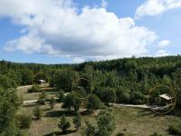 an overhead view of a field with trees in the background at La Grisonne - Chalet 3 in Revest-du-Bion