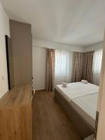 Posteľ alebo postele v izbe v ubytovaní Apartmani Svemir