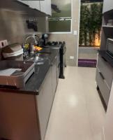 a kitchen with a sink and a counter top at La Estancia Residencial in Iguape