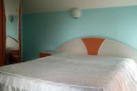 Postel nebo postele na pokoji v ubytování Hotel Kamelia