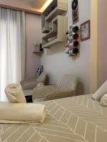 Postel nebo postele na pokoji v ubytování Orange Central Studio Heraklion