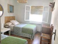 A bed or beds in a room at Charming House in El Poyo del Cid with Garden and Terrace