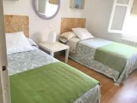 A bed or beds in a room at Charming House in El Poyo del Cid with Garden and Terrace
