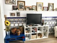 A television and/or entertainment centre at Charming House in El Poyo del Cid with Garden and Terrace