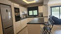 Kuchyň nebo kuchyňský kout v ubytování STAY Executive Retreat