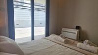Postel nebo postele na pokoji v ubytování STAY Executive Retreat