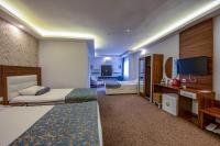 Postel nebo postele na pokoji v ubytování Madi otel