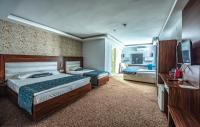 Postel nebo postele na pokoji v ubytování Madi otel