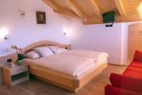 Łóżko lub łóżka w pokoju w obiekcie Agritur Maso Chemela