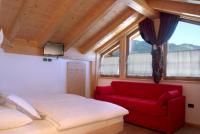 Łóżko lub łóżka w pokoju w obiekcie Agritur Maso Chemela