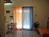 A bed or beds in a room at Vacations in Patra Studios