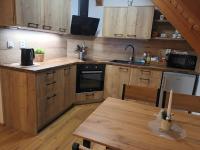 Kuchyň nebo kuchyňský kout v ubytování Apartmány u vlčích jam