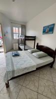 a bedroom with two beds in a room at Hotel Nils in Itapoa