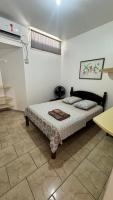 a bedroom with a bed in a room at Hotel Nils in Itapoa