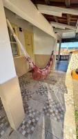 a hammock hanging from the side of a building at Hotel Nils in Itapoa