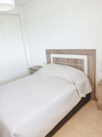 A bed or beds in a room at Spacious Apartment with Sea View in Estepona - 140 m²