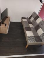 Televízia a/alebo spoločenská miestnosť v ubytovaní Petite maison cocooning