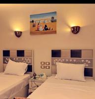 Postel nebo postele na pokoji v ubytování City centre Nile Breeze Aswan