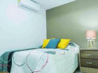 Postel nebo postele na pokoji v ubytování Room in Condo - Malecon Cozy - Premium Plus 19