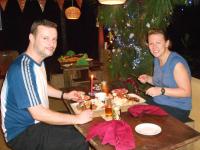 un hombre y una mujer sentados en una mesa con un plato de comida en 360 Rainforest, en Deniyaya