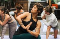a group of women in a yoga class at Never at Home Kloof Street in Cape Town