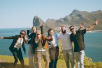 a group of people walking on a hill near the ocean at Never at Home Kloof Street in Cape Town
